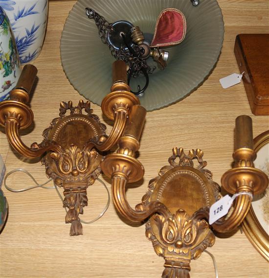 A pair of French gilt 2 branch sconces and a glass hanging light